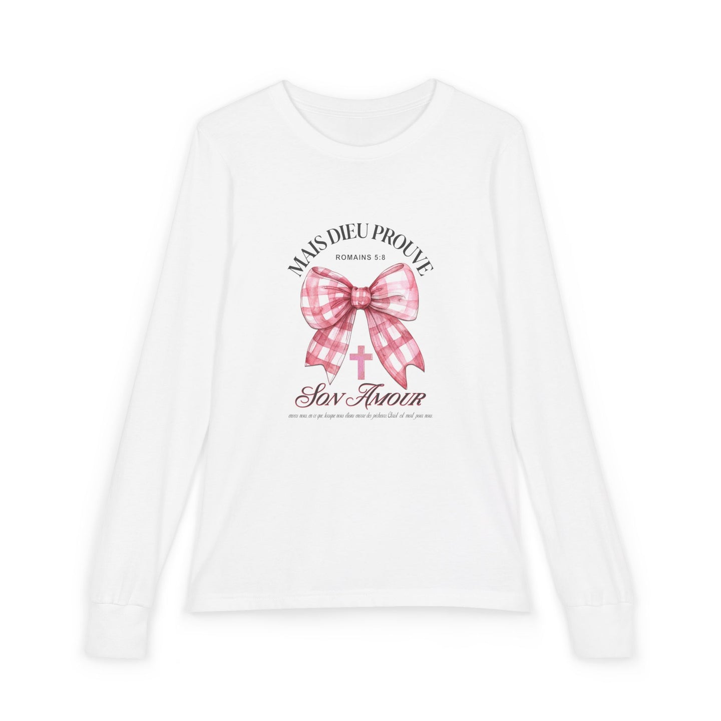 T-shirt blanc manches longues enfant avec nœud rose et texte biblique Mais Dieu prouve son amour.