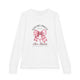 T-shirt blanc manches longues enfant avec nœud rose et texte biblique Mais Dieu prouve son amour.