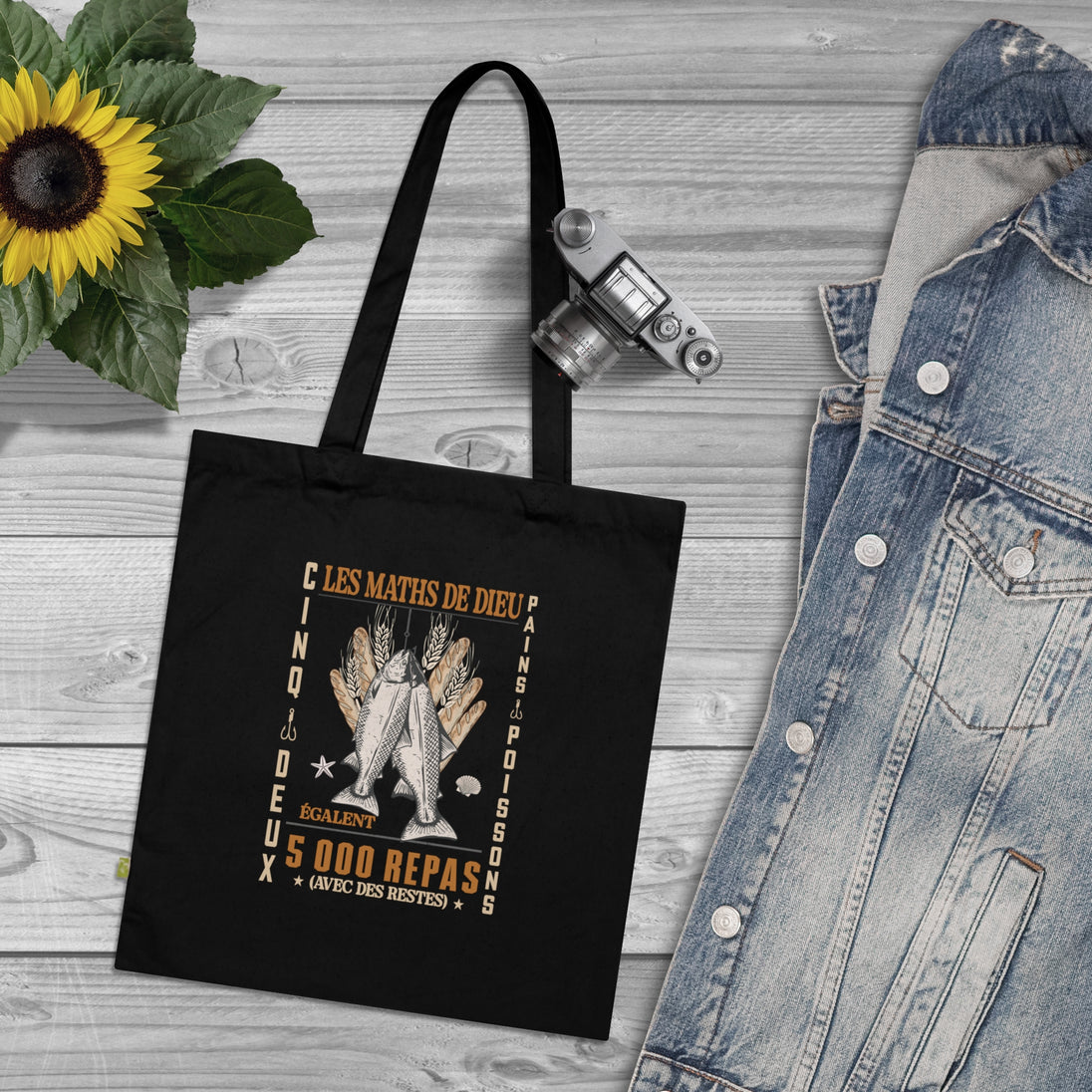 Tote bag noir en coton biologique orné d'une illustration religieuse sur le thème des pains.