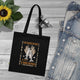 Tote bag noir en coton biologique orné d'une illustration religieuse sur le thème des pains.