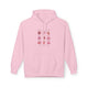 Sweat à capuche rose pâle pour femme avec une illustration de fruits et texte sur la poitrine.
