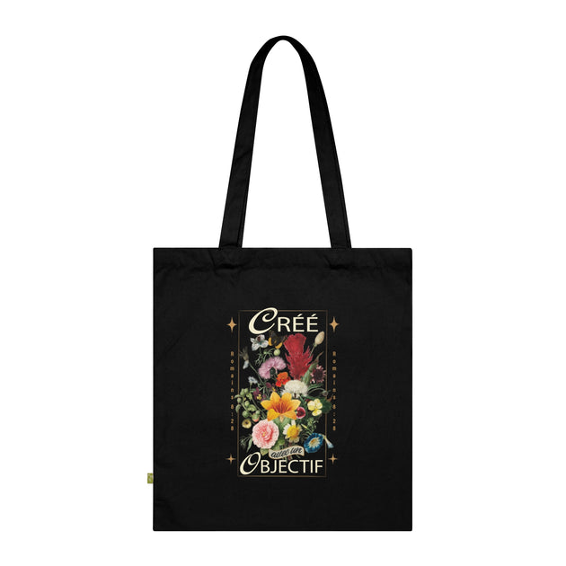 Tote bag noir en coton biologique orné d'un bouquet de fleurs et de l'inscription Créé avec un objectif.
