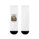 Paire de chaussettes blanches avec un motif de désert coloré et un texte biblique en français.