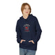 Une femme porte un sweat à capuche bleu marine avec un motif religieux centré sur la poitrine.