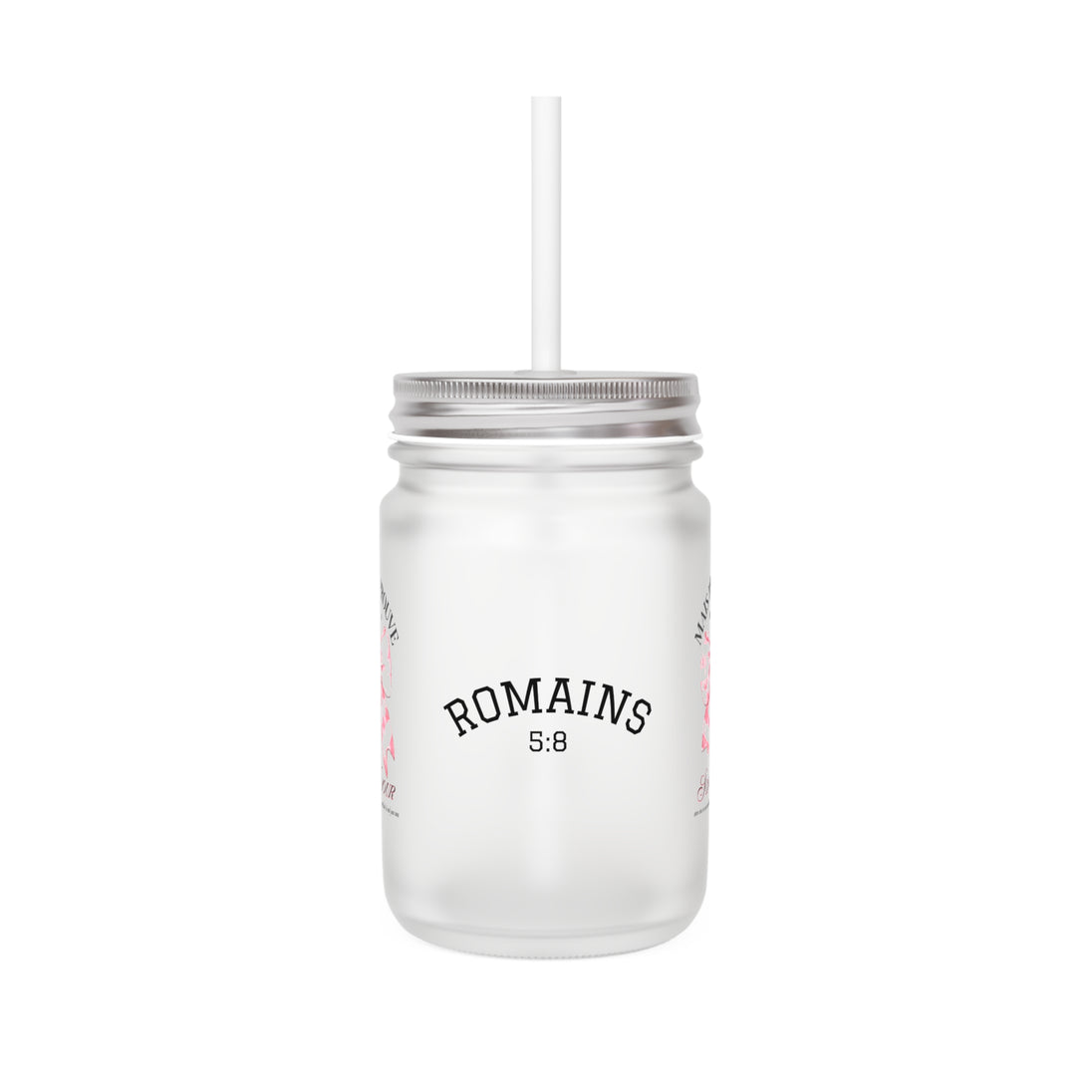 Un bocal Mason en verre dépoli avec couvercle, paille et l'inscription Romains 5:8.