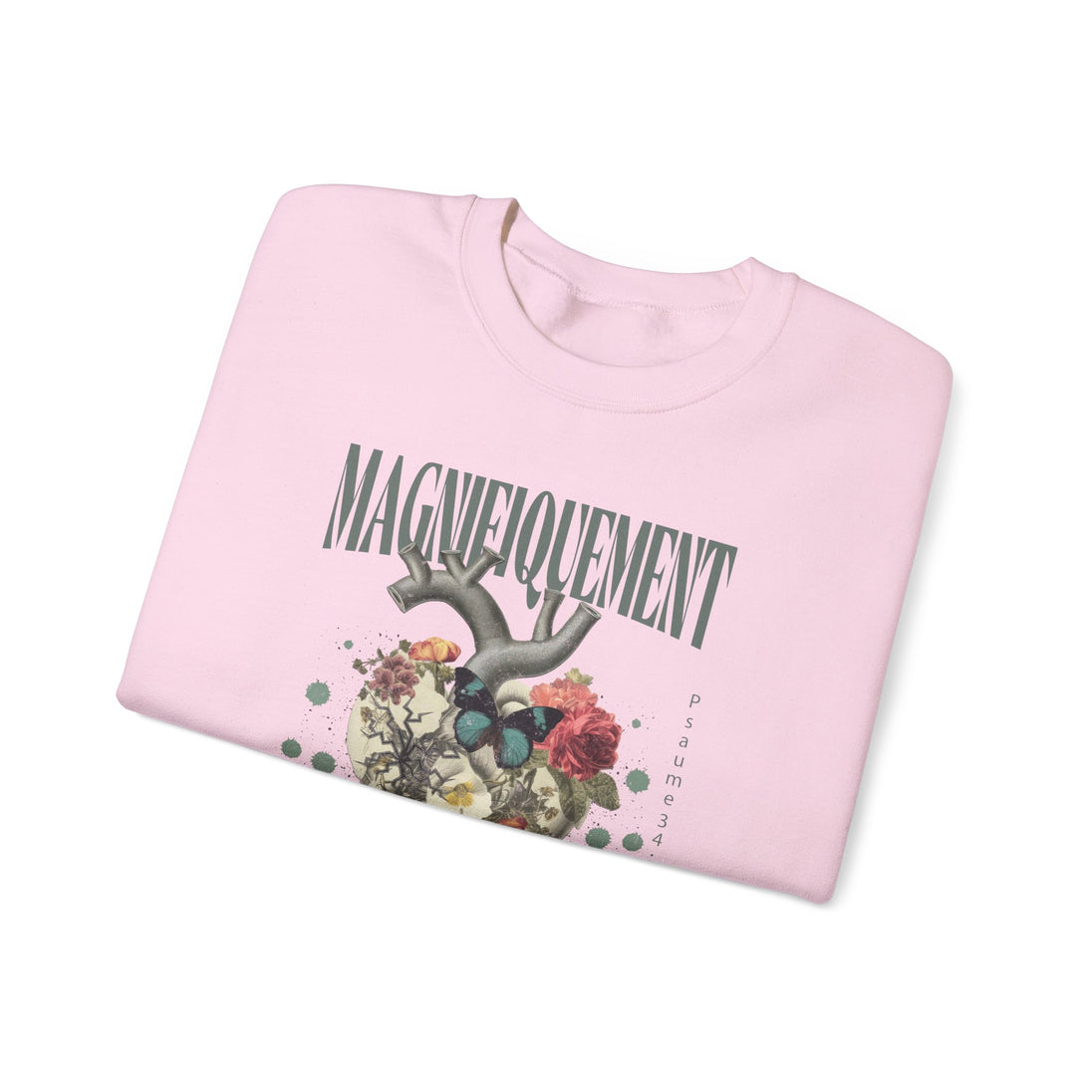 Sweat-shirt rose plié avec une illustration de cœur floral, un papillon et le texte Magnifiquelement.
