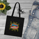 Tote bag noir en coton biologique avec le motif coloré Jésus est mon superhéros.