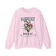 Sweat-shirt rose à col rond avec une illustration de cœur floral et un texte religieux en français.