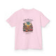 T-shirt rose pour enfant avec une illustration de désert et un texte biblique en français.