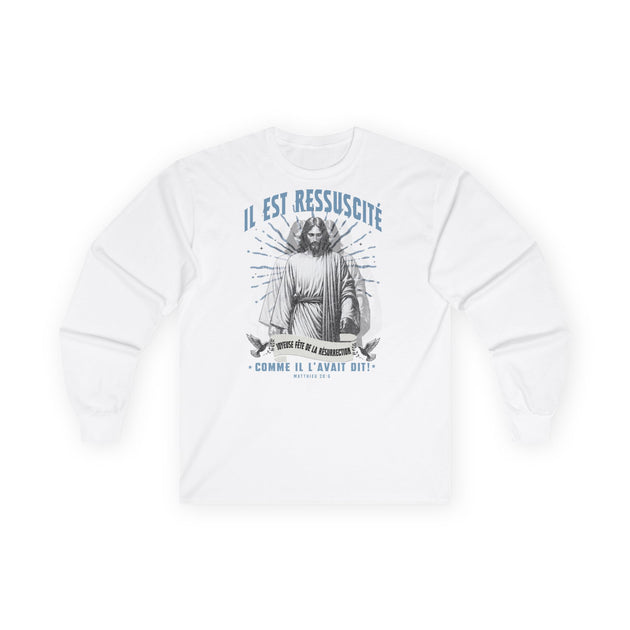 T-shirt blanc à manches longues avec une illustration religieuse et le texte Il est ressuscité.