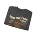 Sweat-shirt gris foncé plié avec une illustration de cowboy face au soleil et le texte en français.