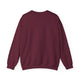 Sweat-shirt pour femme de couleur bordeaux, présenté de dos sur un fond blanc.
