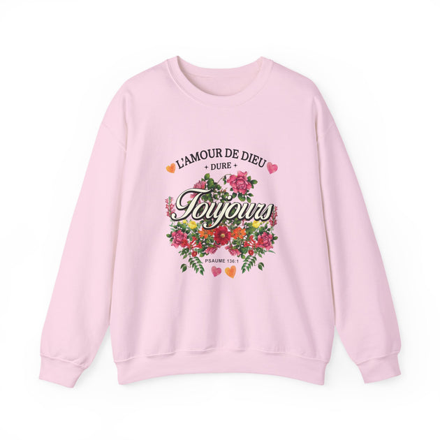 Sweat-shirt rose pâle orné d'un motif floral et de l'inscription L'amour de Dieu dure toujours.