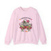 Sweat-shirt rose pâle orné d'un motif floral et de l'inscription L'amour de Dieu dure toujours.
