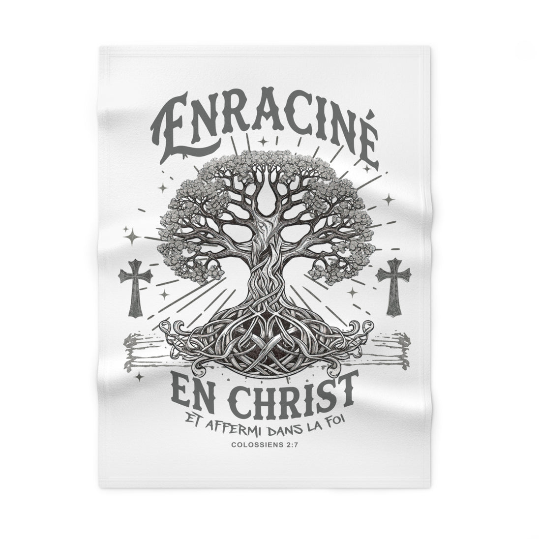 Couverture blanche en polaire avec un motif d'arbre de vie et le texte Enraciné en Christ.