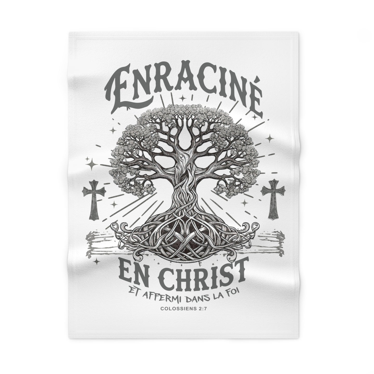 Couverture blanche en polaire avec un motif d'arbre de vie et le texte Enraciné en Christ.