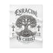 Couverture blanche en polaire avec un motif d'arbre de vie et le texte Enraciné en Christ.