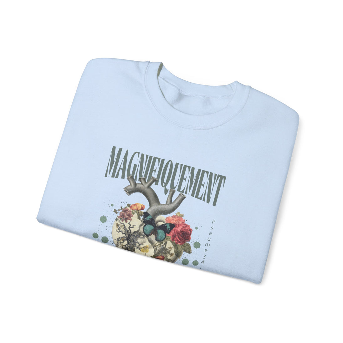 Sweat-shirt bleu clair plié avec une illustration de cœur floral et le mot Magnifiquement.