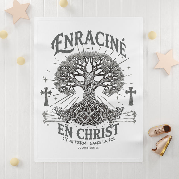 Couverture bébé blanche illustrée d'un arbre de vie et du texte chrétien Enraciné en Christ.